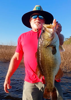 Angler with gorgeous black bass in lake picachos mazatlan sinaloa mexico