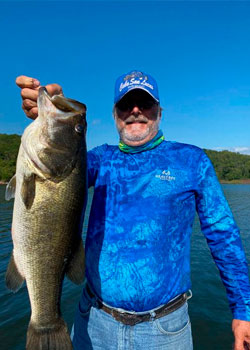 Angler with gorgeous black bass in lake picachos mazatlan sinaloa mexico