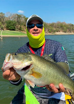 Angler with gorgeous black bass in lake picachos mazatlan sinaloa mexico